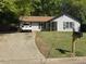 Inviting single-story home with tidy landscaping, long driveway, and traditional design at 5516 Westberry Ln, Norcross, GA 30071