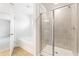 Bathroom featuring a separate tub and shower with tiled walls, plus wood-look vinyl floors at 7188 Brushwood Bend (115), Lithonia, GA 30058