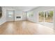 Expansive living room with hardwood floors, a modern fireplace, and a sliding glass door to backyard at 7188 Brushwood Bend (115), Lithonia, GA 30058