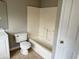 Bathroom with a tub-shower combination, single vanity, and neutral-toned decor at 810 Martin Se St, Atlanta, GA 30315