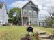 Charming two-story home with gray siding, shuttered windows, and a well-manicured front lawn at 810 Martin Se St, Atlanta, GA 30315