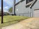 Side of the house with a long driveway, garage, and well-maintained lawn at 810 Martin Se St, Atlanta, GA 30315