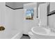 A bathroom with a sink, toilet, and a tub at 948 Sycamore Dr, Decatur, GA 30030