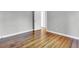 Empty bedroom featuring hardwood floors and light-colored walls at 948 Sycamore Dr, Decatur, GA 30030