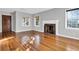 Spacious living room with hardwood floors, fireplace, and natural light at 948 Sycamore Dr, Decatur, GA 30030
