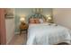 Bright bedroom featuring a bed with stylish headboard and side tables with lamps, creating a cozy and inviting atmosphere at 2641 Cacao Sq, Acworth, GA 30101