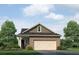 Charming single-Gathering home exterior features a one-car garage and manicured lawn at 2641 Cacao Sq, Acworth, GA 30101