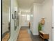 Bright hallway with wood floors, bench, hooks and decorative mirrors at 2641 Cacao Sq, Acworth, GA 30101