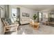 Sunlit living room features stylish seating, decor, and large windows at 2641 Cacao Sq, Acworth, GA 30101