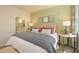 Serene main bedroom with green accent wall and view into the ensuite bathroom at 2641 Cacao Sq, Acworth, GA 30101