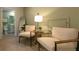 Sitting area between rooms features comfortable chairs, small table, and access to a bathroom at 2641 Cacao Sq, Acworth, GA 30101