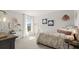Bright bedroom with decorative accents, stylish furniture, and soft natural light from a window at 3790 Near Star Ln, Cumming, GA 30028