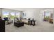 Open living area with comfortable seating, neutral walls, and seamless flow into other rooms at 3790 Near Star Ln, Cumming, GA 30028