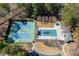Community amenities with a tennis court and pool surrounded by trees at 395 Highland Gate Cir, Suwanee, GA 30024