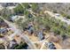 Discover a serene neighborhood with winding roads and lush greenery from above at 395 Highland Gate Cir, Suwanee, GA 30024