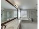 Bathroom with double vanity, soaking tub, and separate glass shower at 395 Highland Gate Cir, Suwanee, GA 30024