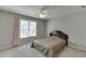 Bedroom featuring neutral walls, carpet, ceiling fan and a window with light-filtering blinds at 395 Highland Gate Cir, Suwanee, GA 30024