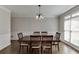 Traditional dining room featuring wood floors, chair rail, and a chandelier at 395 Highland Gate Cir, Suwanee, GA 30024