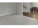 Cozy carpeted room with views to a staircase and dining room at 395 Highland Gate Cir, Suwanee, GA 30024