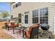 Exterior backyard patio with grill, outdoor furniture, and partially fenced lawn space at 4037 Hill Station Ct, Sugar Hill, GA 30518