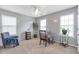 Comfortable bedroom featuring natural light, neutral carpet, and gray walls, great for relaxing at 4037 Hill Station Ct, Sugar Hill, GA 30518