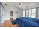 Bedroom features a vaulted ceiling, hardwood floors, and two closets at 4037 Hill Station Ct, Sugar Hill, GA 30518