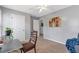 Bedroom with neutral carpeting, desk, and gray walls, offering a calming atmosphere at 4037 Hill Station Ct, Sugar Hill, GA 30518