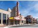 Classic, art deco style theater with prominent marquee and vibrant signage is an entertainment destination at 4037 Hill Station Ct, Sugar Hill, GA 30518
