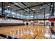 Bright gymnasium featuring basketball court, bleachers, and 'Big Home' painted, creating a welcoming sports environment at 4037 Hill Station Ct, Sugar Hill, GA 30518