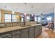 Open-concept kitchen featuring granite countertops, stainless steel appliances, and hardwood flooring at 4037 Hill Station Ct, Sugar Hill, GA 30518