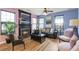 Inviting living room with a fireplace, hardwood floors, and modern decor at 4037 Hill Station Ct, Sugar Hill, GA 30518