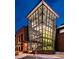 Modern glass enclosed stairwell, offering views and an architectural detail, is an airy and bright space at 4037 Hill Station Ct, Sugar Hill, GA 30518