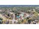 Serene aerial view of a quiet neighborhood featuring mature trees, homes, and neighborhood amenities at 4090 Cherry Ridge Walk, Suwanee, GA 30024