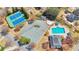 Overhead shot showcasing community tennis courts, ample parking, a swimming pool and recreation center in a community at 4090 Cherry Ridge Walk, Suwanee, GA 30024