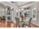 Inviting dining area featuring hardwood floors, natural light from large windows, and views of the backyard at 4090 Cherry Ridge Walk, Suwanee, GA 30024