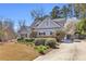 This beautiful home features manicured landscaping, flowering trees, and a private driveway, offering a serene and inviting atmosphere at 4090 Cherry Ridge Walk, Suwanee, GA 30024