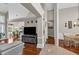 Spacious open-concept layout with hardwood floors, neutral colors, and seamless flow between the living, dining, and foyer areas at 4090 Cherry Ridge Walk, Suwanee, GA 30024