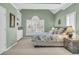 Well-lit main bedroom with large windows, neutral carpet, and a ceiling fan at 4090 Cherry Ridge Walk, Suwanee, GA 30024