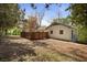 Backyard view of the home featuring a privacy fence and a well maintained landscape at 517 Toombs St, Palmetto, GA 30268