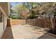Fenced backyard with stone patio at 517 Toombs St, Palmetto, GA 30268