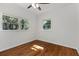 Sunlit bedroom with hardwood floors, neutral paint, and large windows at 517 Toombs St, Palmetto, GA 30268
