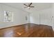 Spacious bedroom with hardwood floors, a ceiling fan, and double closets offers comfort and ample storage at 517 Toombs St, Palmetto, GA 30268
