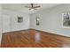 A bedroom bathed in natural light, featuring hardwood floors and neutral walls that offer a serene and inviting space at 517 Toombs St, Palmetto, GA 30268
