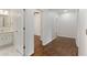 Hallway view showing access to a bedroom and updated bathroom at 517 Toombs St, Palmetto, GA 30268
