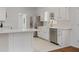 Bright kitchen with stainless steel appliances, white cabinets, and an island at 517 Toombs St, Palmetto, GA 30268