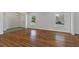 Bright living room featuring hardwood floors, neutral walls, and large windows for natural light at 517 Toombs St, Palmetto, GA 30268