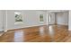 Hardwood floors and neutral walls in this spacious living room with lots of natural light at 517 Toombs St, Palmetto, GA 30268