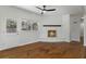 Hardwood floors, brick fireplace, and neutral walls at 517 Toombs St, Palmetto, GA 30268