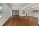 Spacious living room with hardwood floors, neutral walls, and large windows providing natural light at 517 Toombs St, Palmetto, GA 30268