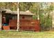 Cozy backyard deck with lattice surround, perfect for relaxing or entertaining outdoors at 1185 Highway 162, Covington, GA 30016